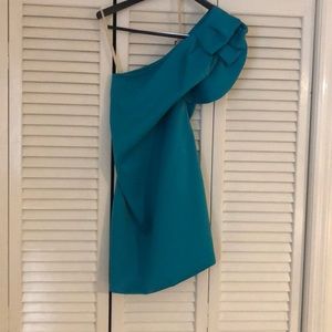 Turquoise one shoulder dress.